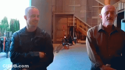 Two Men Smiling Side By Side GIF