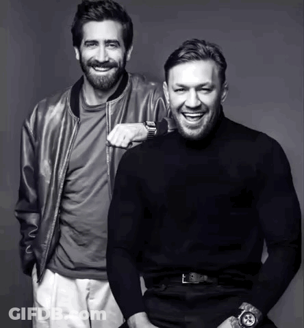 Two Men Smiling Side By Side GIF