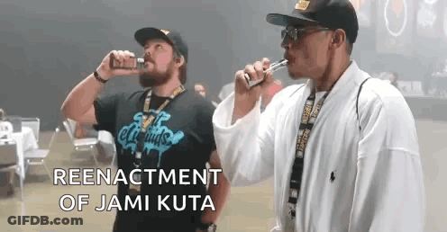 Two Men Smoking E-Cigarettes Reenactment Of Jami Kuta GIF