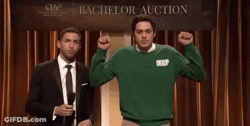 Two Men Stand In Front Of A Bachelor Auction Sign GIF