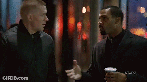 Two Men Standing And Talking GIF