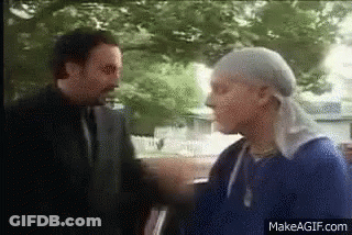 Two Men Standing And Talking GIF