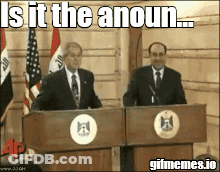 Two Men Standing At Podiums With A Caption That Says Is It The Anoun GIF