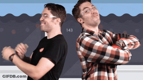Two Men Standing Beside Number 143 GIF