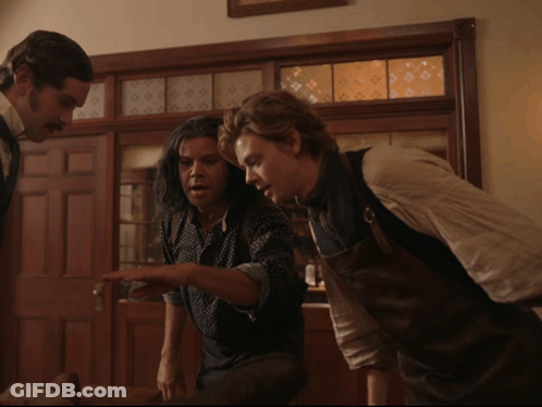 Two Men Standing By Door GIF