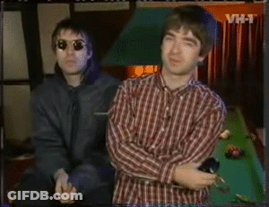 Two Men Standing By Pool Table With VH-T Background GIF