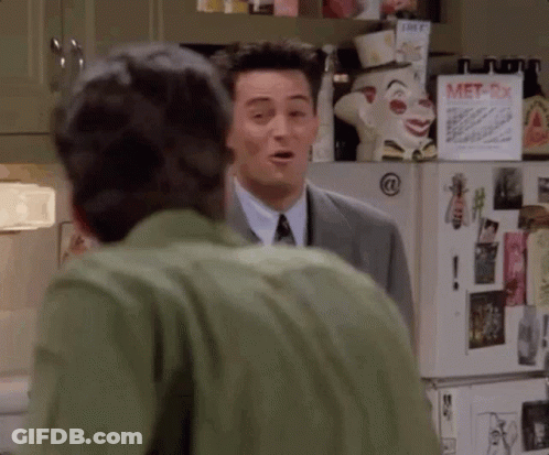 Two Men Standing By Refrigerator GIF