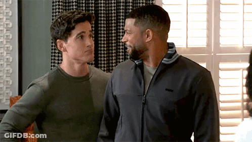 Two Men Standing By Window One Wearing Patagonia Jacket GIF