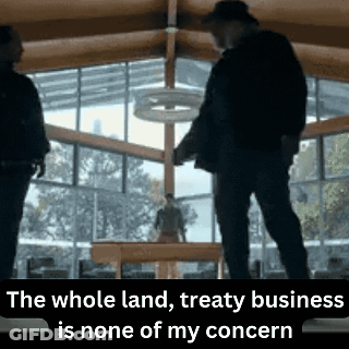 Two Men Standing In A Room With The Words " The Whole Land Treaty Business Is None Of My Concern " GIF