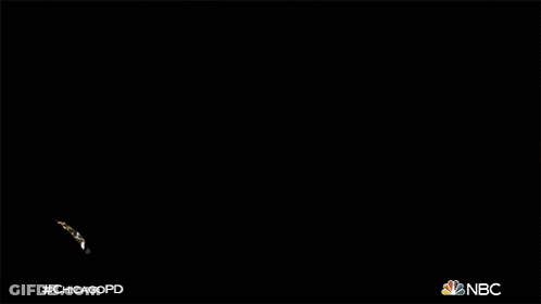 Two Men Standing In Back Of Car With NBC Logo GIF