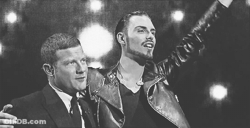 Two Men Standing In Black And White Photo GIF