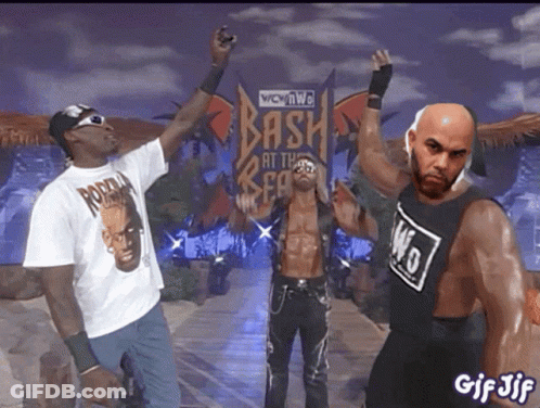 Two Men Standing In Crowd GIF