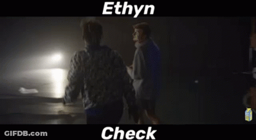 Two Men Standing In Dark Room GIF