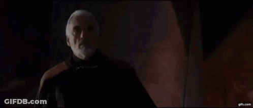 Two Men Standing In Dark Room With Lightning GIF
