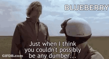 Two Men Standing In Field Talking GIF