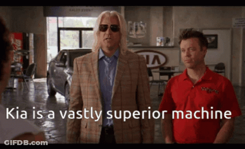 Two Men Standing In Front Of A Kia Dealership With The Caption Kia Is A Vastly Superior Machine GIF