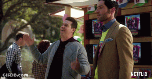 Two Men Standing In Front Of A Netflix Store GIF