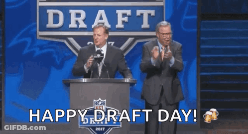 Two Men Standing In Front Of A Podium That Says Draft GIF