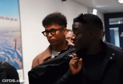 Two Men Standing In Front Of A Poster That Says ' Aerial View ' GIF