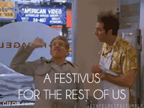 Two Men Standing In Front Of A Sign That Says ' American Video ' GIF
