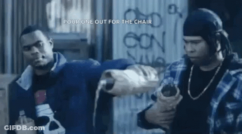 Two Men Standing In Front Of Graffiti Wall GIF