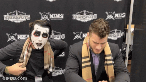 Two Men Standing In Front Of Highspots Banner GIF