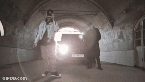 Two Men Standing In Front Of Mercedes GIF