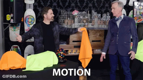 Two Men Standing In Front Of Motion Table GIF