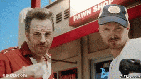 Two Men Standing In Front Of Pawn Shop GIF