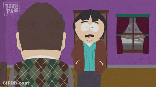 Two Men Standing In Front Of South Park Sign GIF