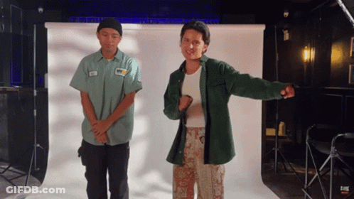 Two Men Standing In Front Of White Background GIF