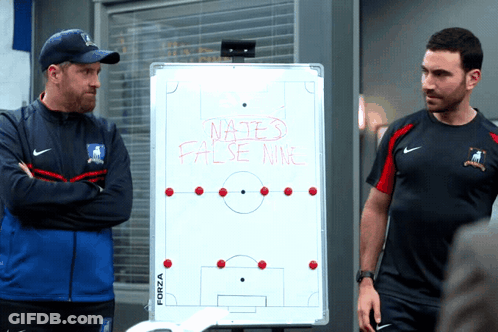 Two Men Standing In Front Of Whiteboard Saying Nates False War GIF