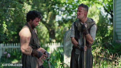 Two Men Standing In Garden GIF