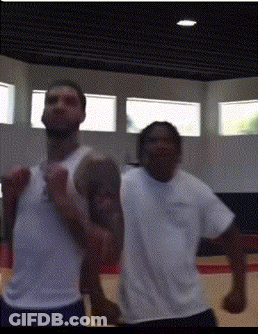 Two Men Standing In Gym GIF