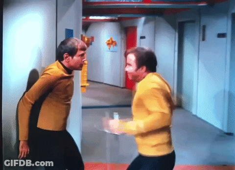 Two Men Standing In Hallway GIF