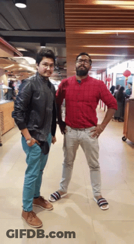 Two Men Standing In Hallway GIF