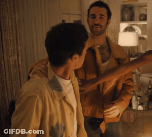 Two Men Standing In Living Room GIF