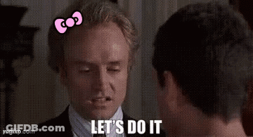 Two Men Standing In Living Room One Talking GIF