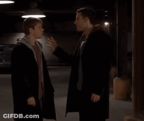 Two Men Standing In Parking Garage GIF