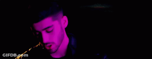 Two Men Standing In Purple Light GIF