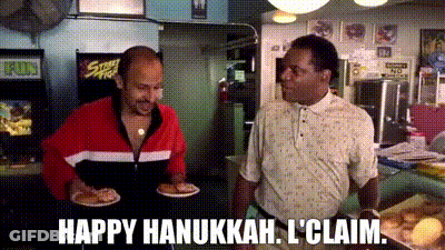 Two Men Standing In Restaurant Saying Happy Hanukkah I Claim GIF