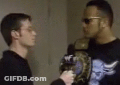Two Men Standing In Room One Wearing Sunglasses GIF