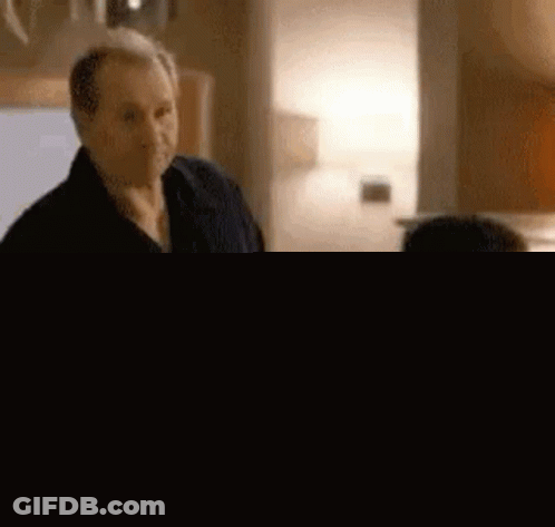 Two Men Standing In Room GIF