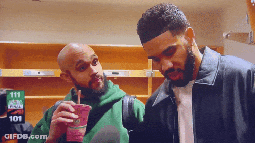 Two Men Standing In Room With Sign 111 GIF