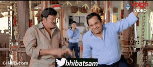 Two Men Standing In Room With Twitter Logo GIF
