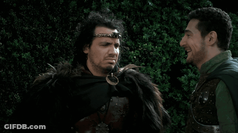 Two Men Standing In Woods GIF