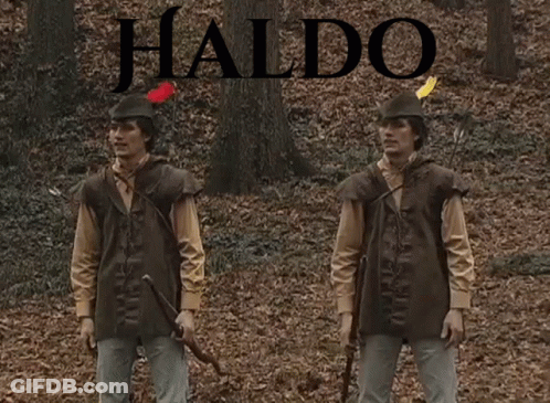 Two Men Standing In Woods With Waldo GIF
