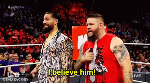 Two Men Standing In Wrestling Ring GIF