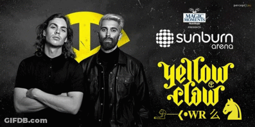 Two Men Standing Near Sunburn Arena Sign GIF