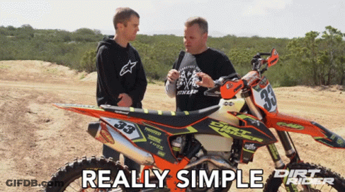 Two Men Standing Next To A Dirt Bike That Says Dirt Rider On It GIF